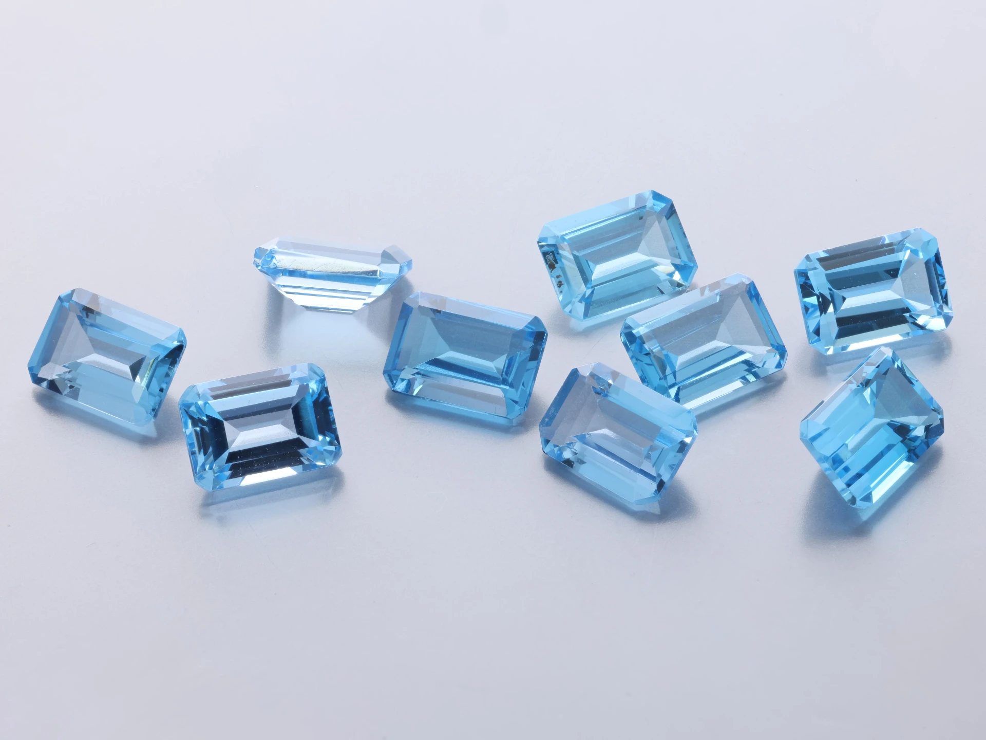 [TMOS0705] Topaz 7x5mm Emerald Cut Medium Blue