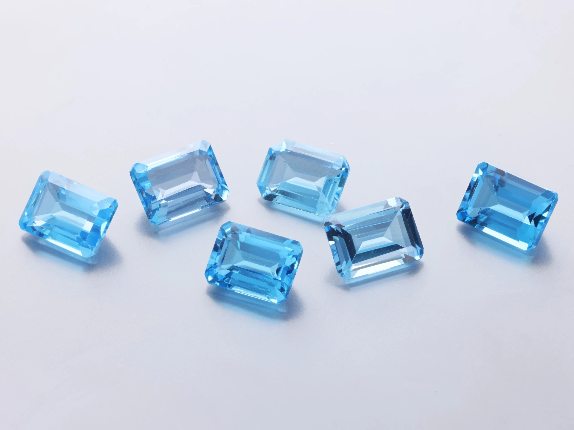 [TMOS0806] Topaz 8x6mm Emerald Cut Medium Blue