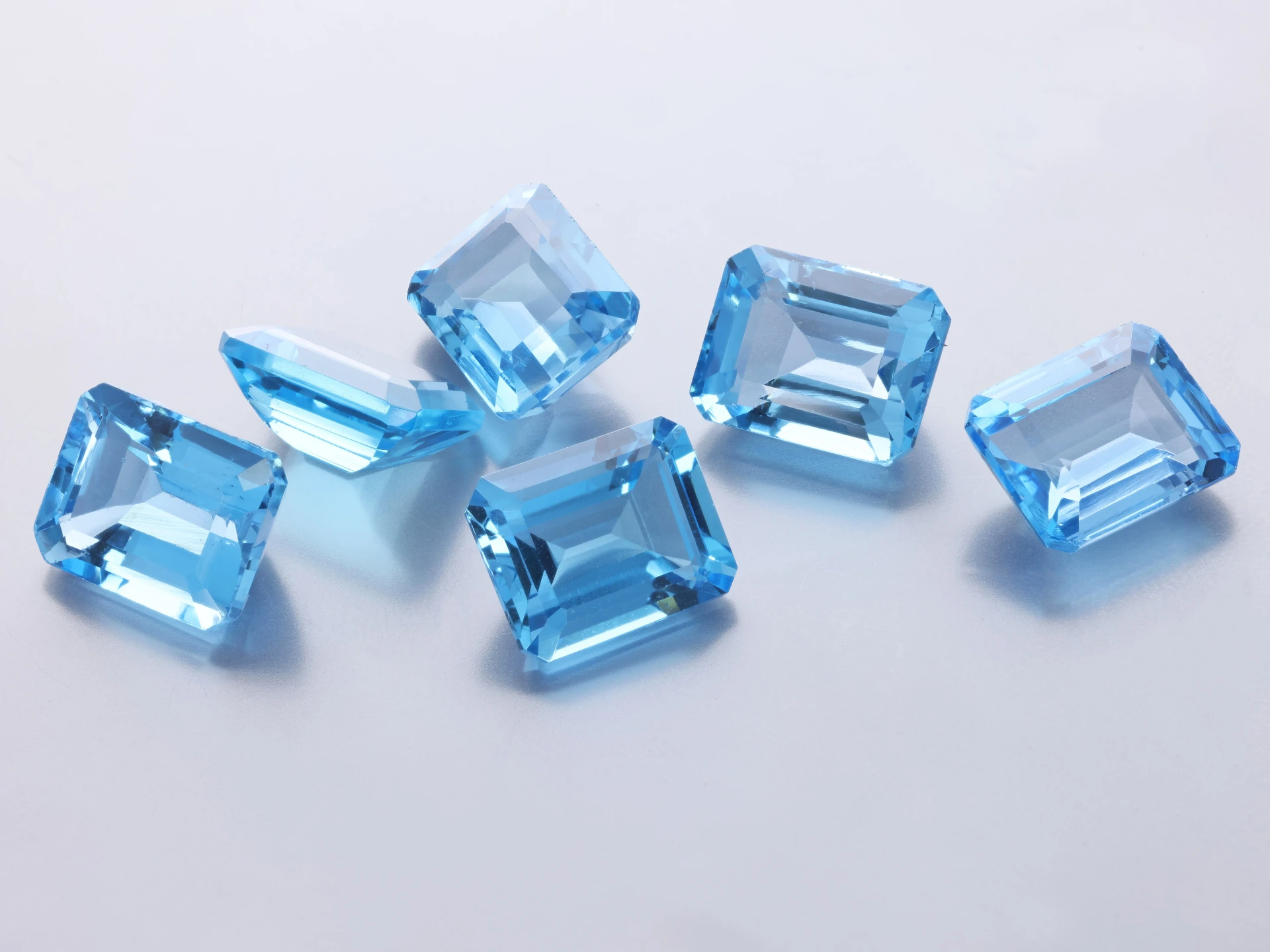 [TMOS1008] Topaz 10x8mm Emerald Cut Medium Blue