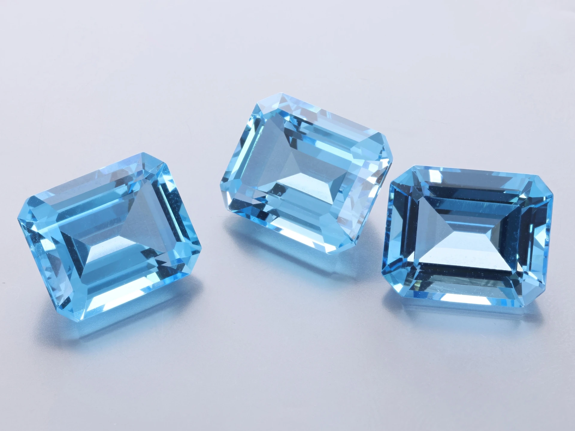 [TMOS1109] Topaz 11x9mm Emerald Cut Medium Blue