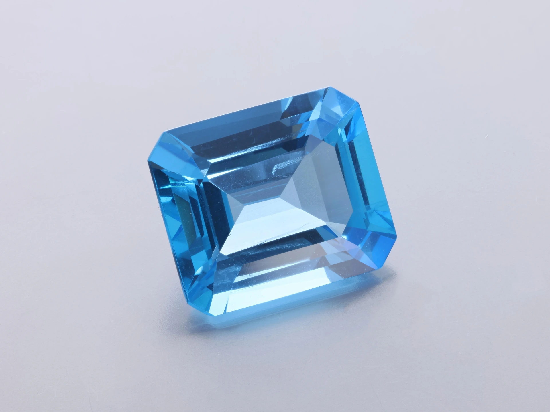 [TMOS1412] Topaz 14x12mm Emerald Cut Medium Blue