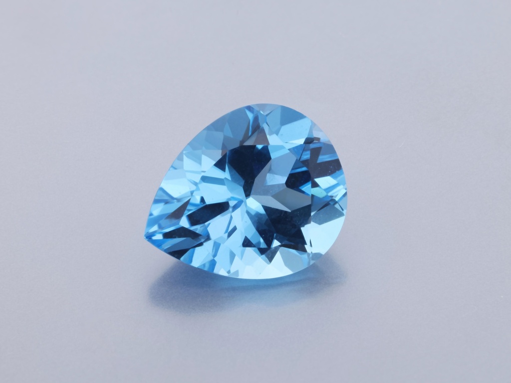 [TMPB1210] Topaz 12x10mm Pear Shape Medium Blue 