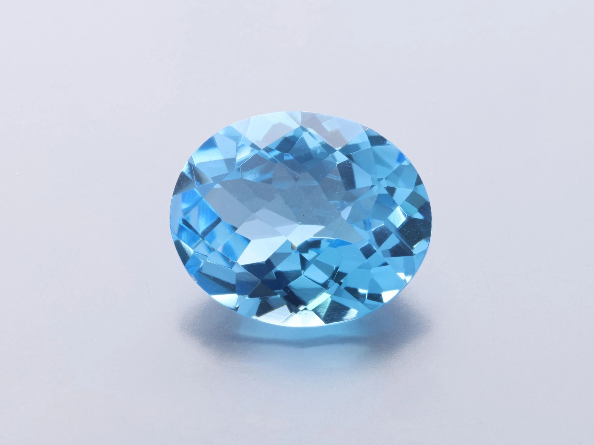 [TMVH1210] Topaz  12x10mm Oval Chequerboard Medium Blue 