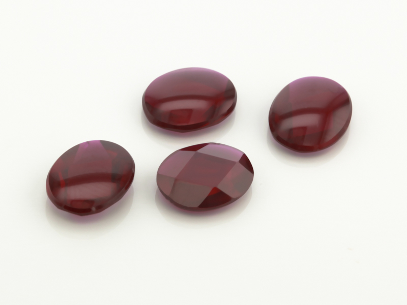 Synthetic/Lab Grown Ruby 10x8mm Oval Buff Top Faceted Back Deep Pavillion Dark Red